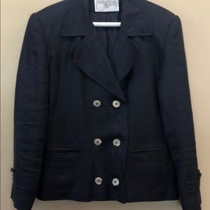 Woman’s short navy jacket/blazer.
